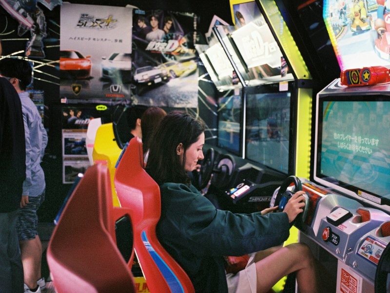 woman driving arcade machine